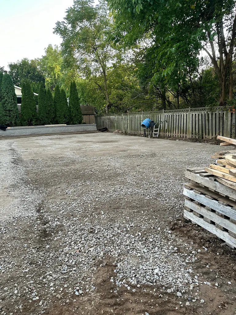Compacted gravel base prepared in a backyard