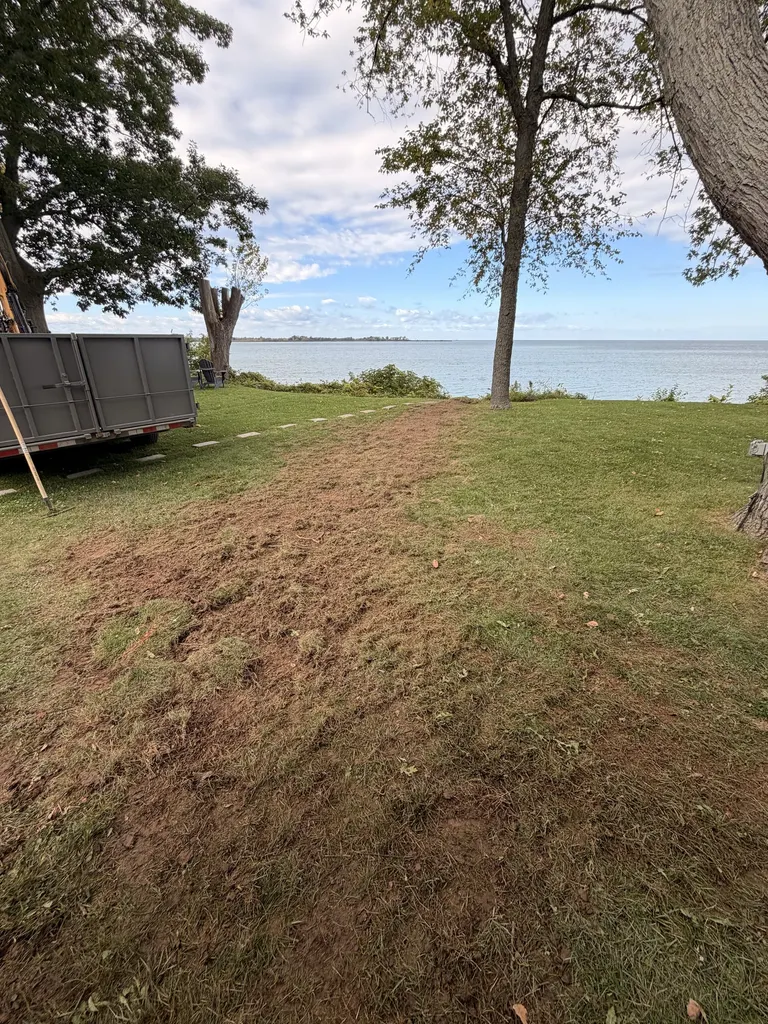 Lakefront lawn regraded and levelled