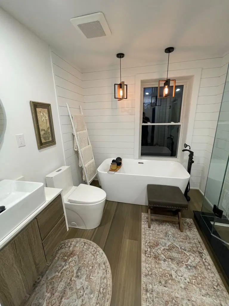 Shiplap bathroom with freestanding tub and floating vanity